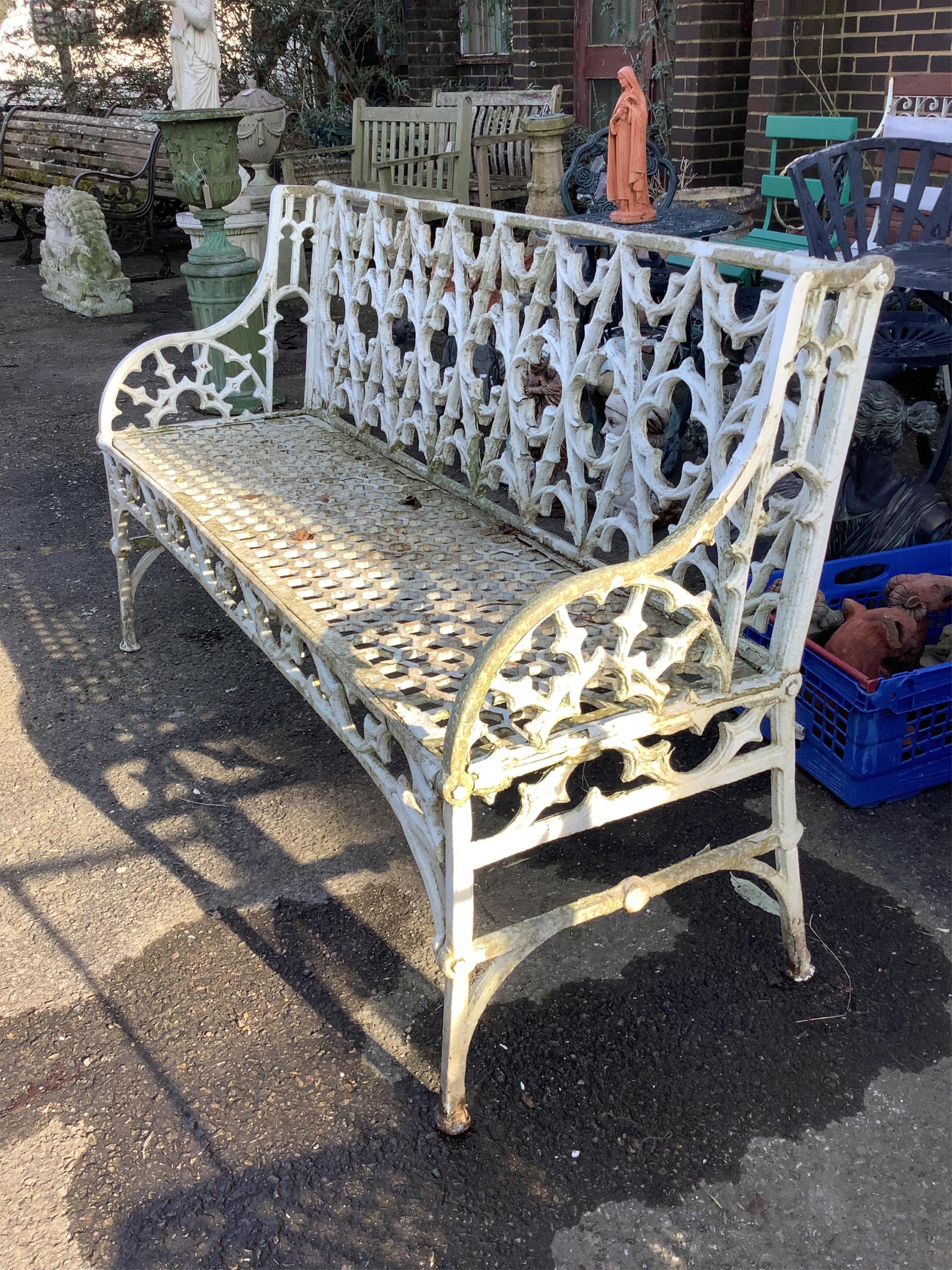 A Victorian style painted aluminium garden bench, width 138cm, height 84cm. Condition - fair
